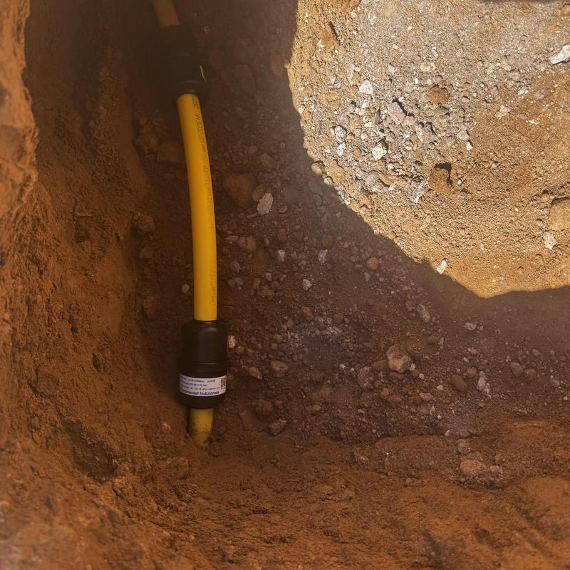 Underground polyethylene gas line with repair coupling Underground polyethylene gas line with repair coupling