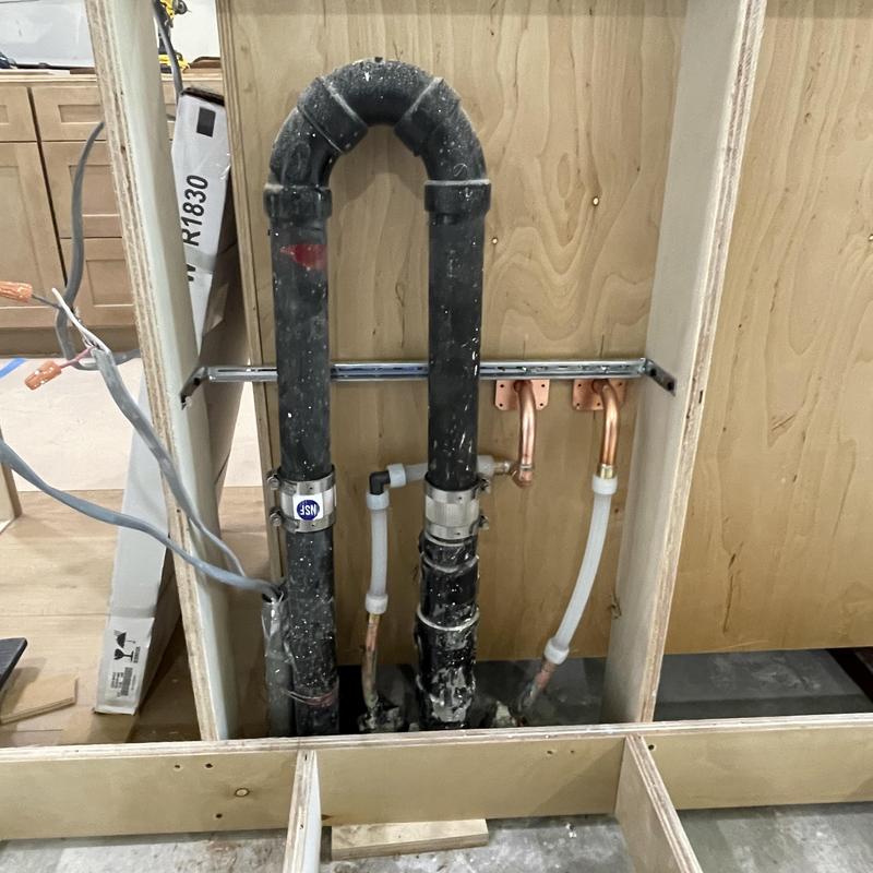 Copper and PEX water lines under kitchen sink cabinet