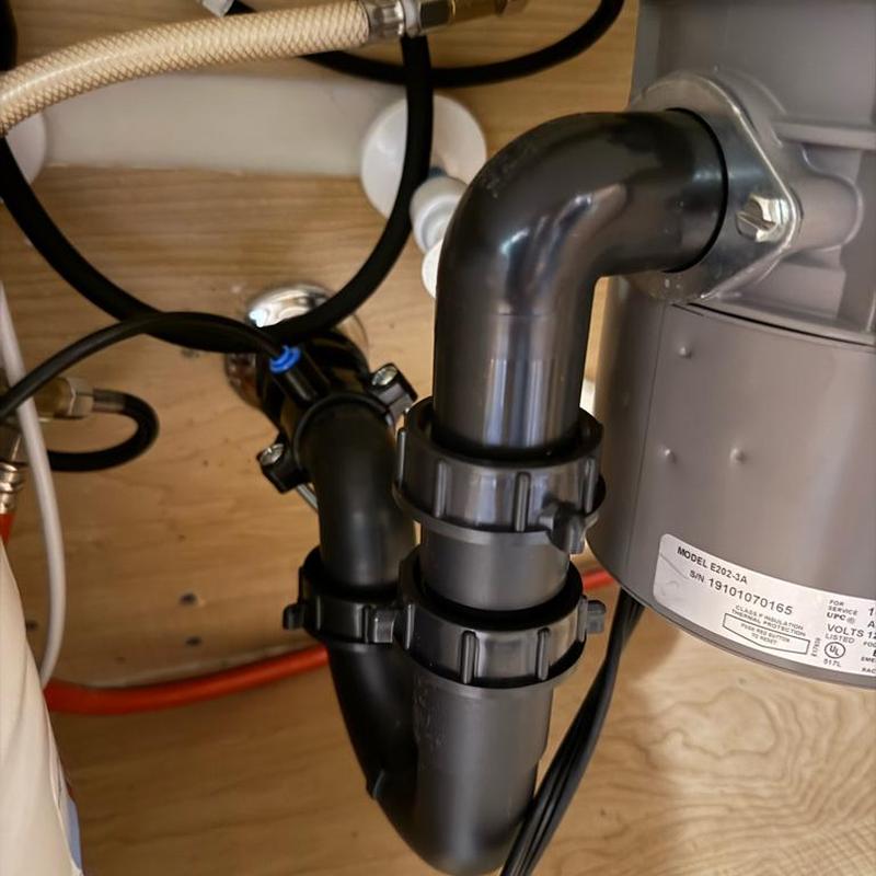 P-trap under kitchen sink with disposal unit installed