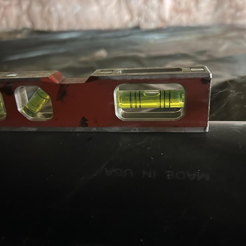 Mainline sewer pipe level check with spirit level tool Mainline sewer pipe level check with spirit level tool