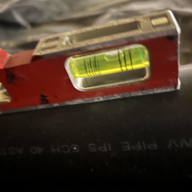 Mainline pipe level check with bubble level tool Mainline pipe level check with bubble level tool
