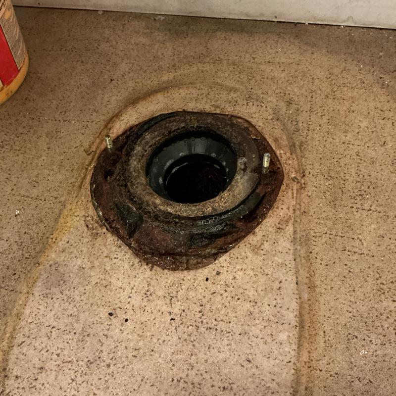 Toilet flange with old wax ring on floor Toilet flange with old wax ring on floor