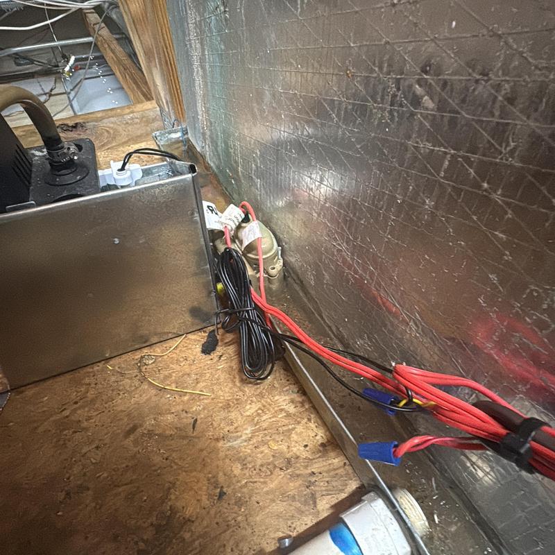 AC condensate pump with wiring in utility space
