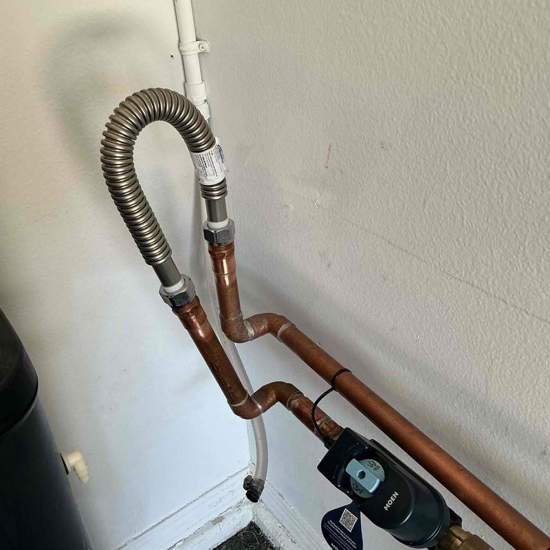 Copper water line loop with flexible connector installed
