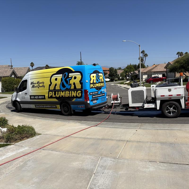 Area drain hydrojetting with R&R Plumbing truck and trailer