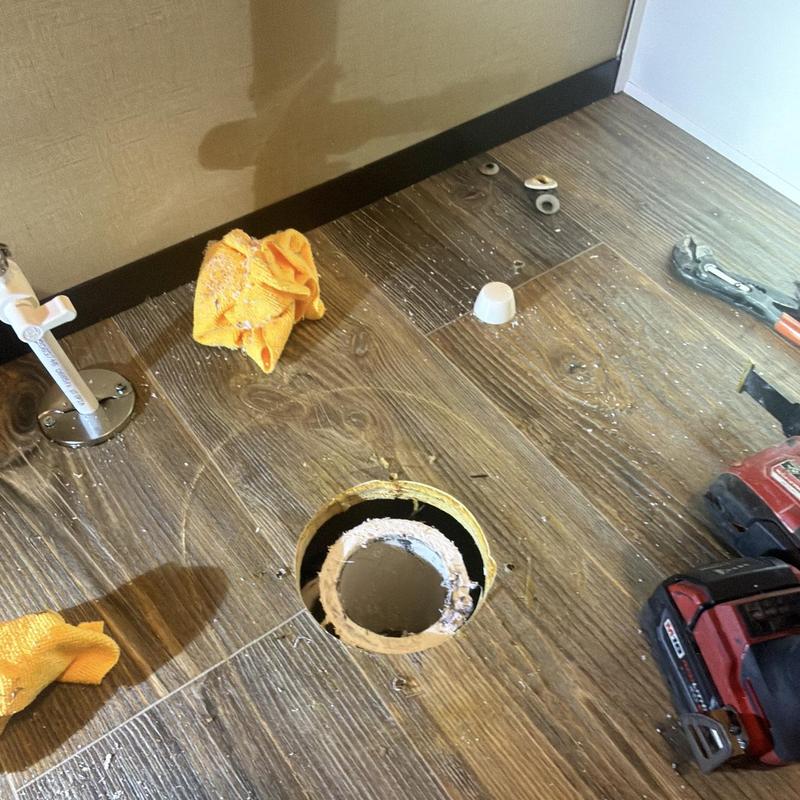 Toilet flange on wood floor cut for replacement