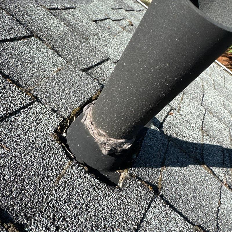 Roof vent pipe flashing on asphalt shingle roof
