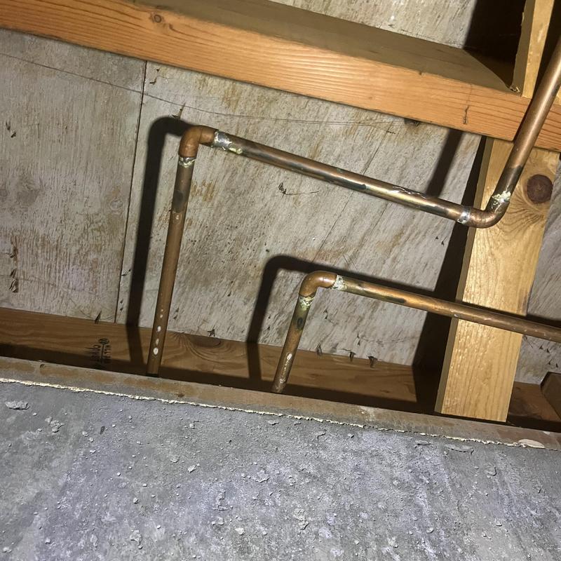 Copper water supply piping with pinhole leak repair in basement Copper water supply piping with pinhole leak repair in basement