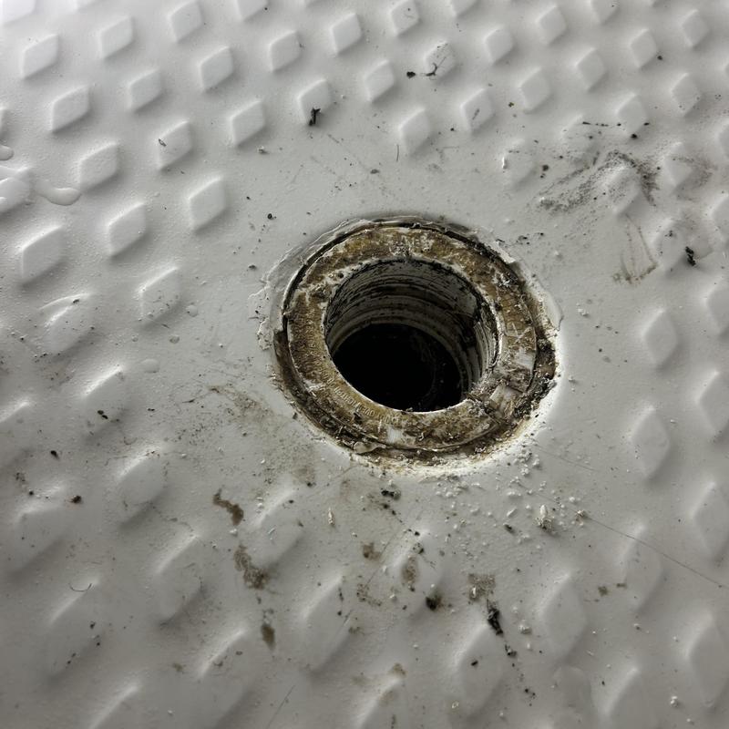 Shower drain pipe opening with old sealant residue Shower drain pipe opening with old sealant residue
