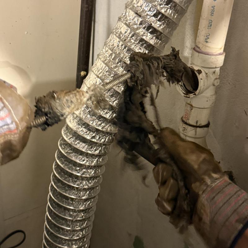 Laundry drain line clog removal with auger tool Laundry drain line clog removal with auger tool