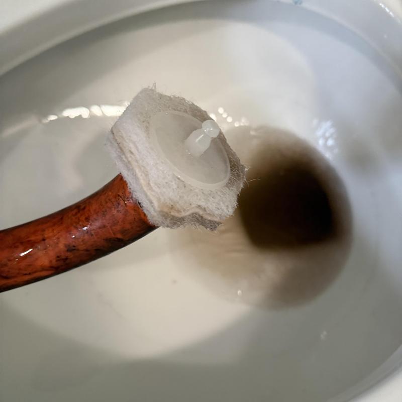 Toilet auger with protective sleeve near drain hole Toilet auger with protective sleeve near drain hole