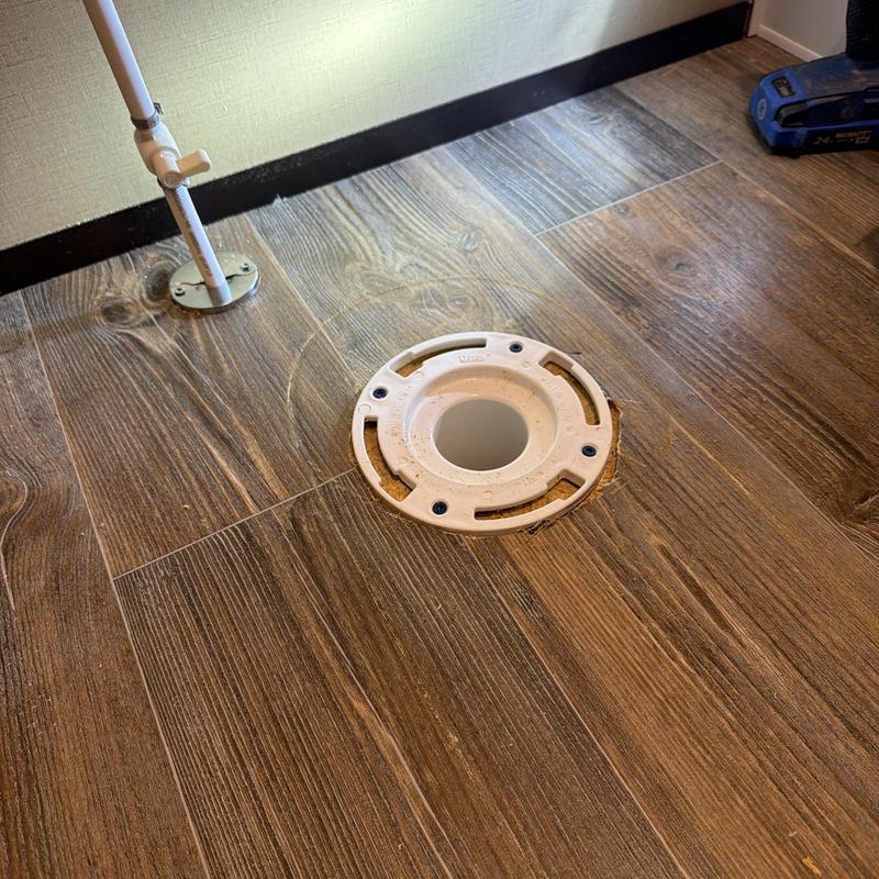 Toilet flange on wood-look tile floor, flange repair