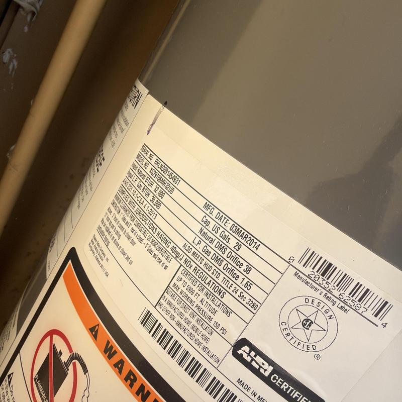 Gas water heater label showing specs and safety info
