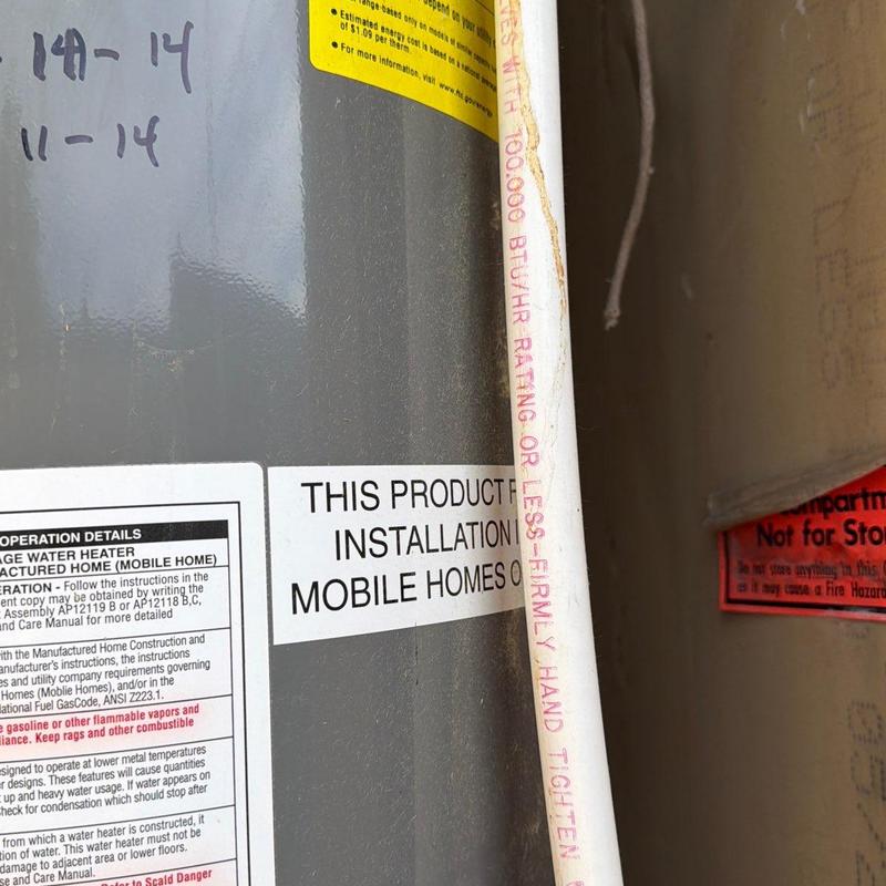Gas water heater with natural gas and water line connections