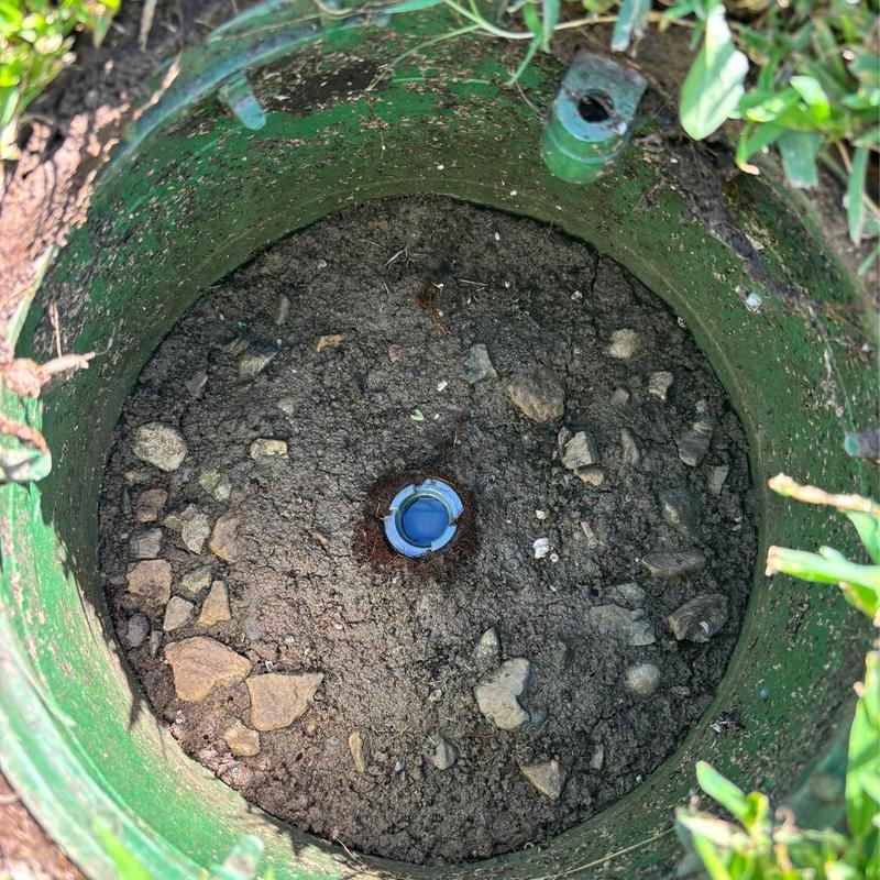 Main irrigation shut-off valve in valve box with soil Main irrigation shut-off valve in valve box with soil