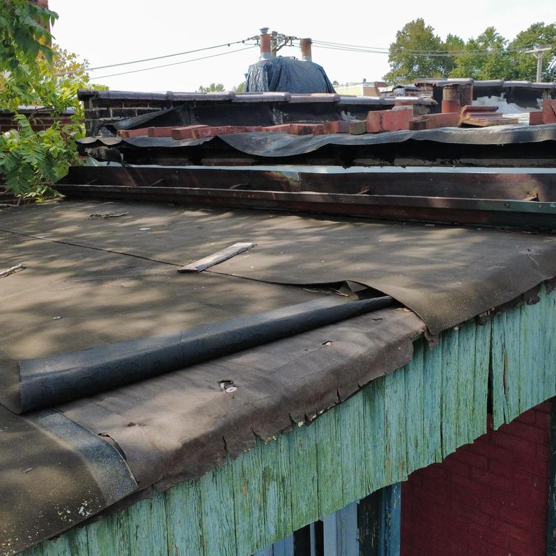 Modified bitumen roof with deteriorated flashing and decking