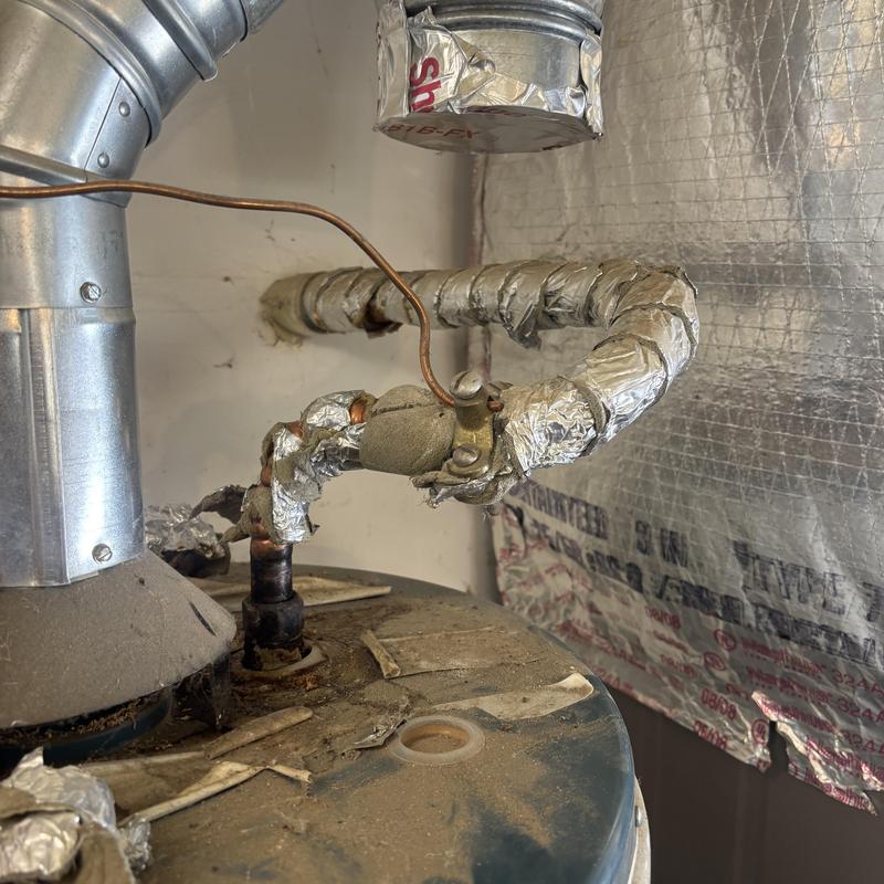 Water heater pipe insulation and vent connection details Water heater pipe insulation and vent connection details