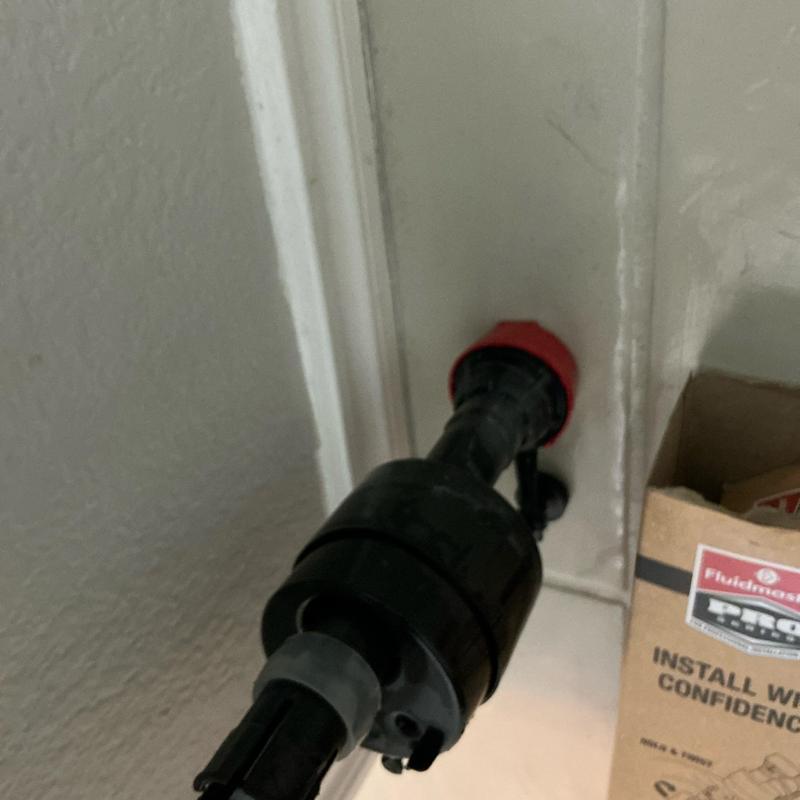 Toilet fill valve installation with red lock nut