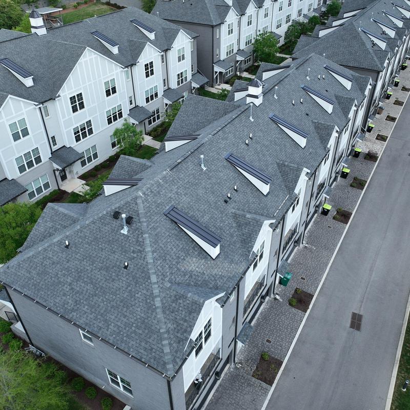 Asphalt shingle roof with skylights and vent pipes