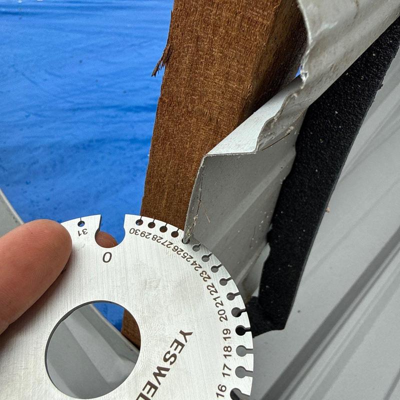 Metal siding panel hail damage with measurement tool