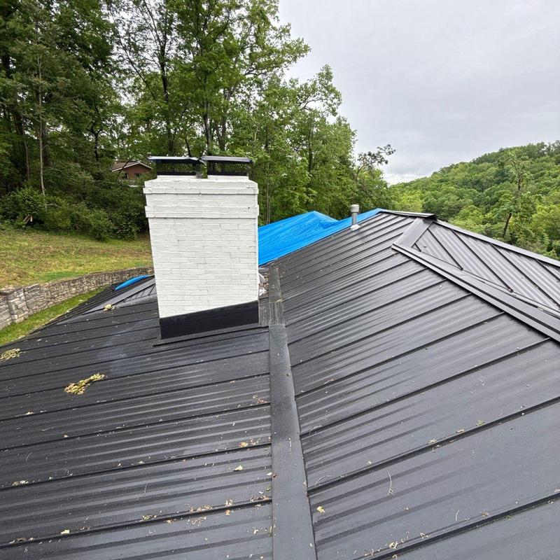 Metal roofing with chimney and protective flashing installation