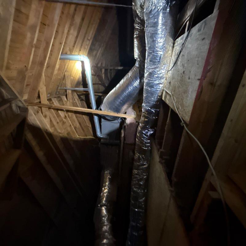 Ductwork and ventilation pipes in attic space