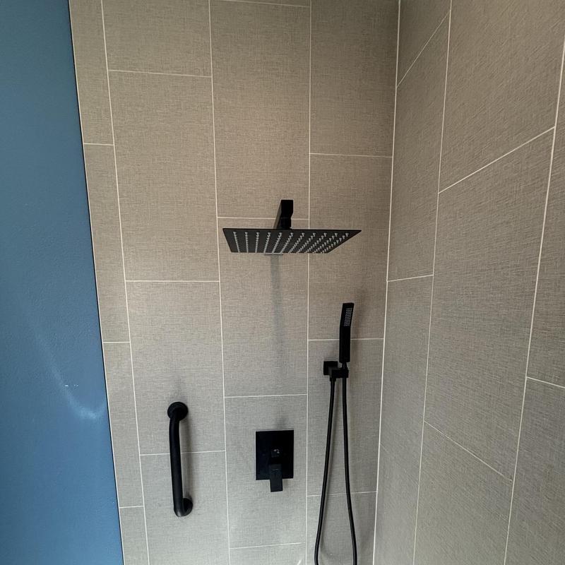 Black shower system with rain head and handheld sprayer Black shower system with rain head and handheld sprayer