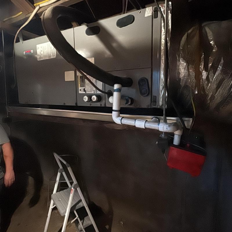Drain pan and PVC drain line on HVAC unit