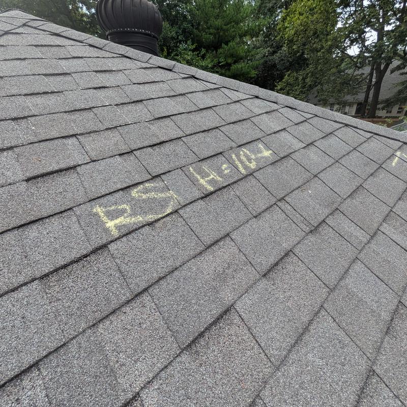 Asphalt shingle roof with chalk damage markings