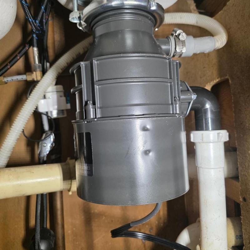 Garbage disposal unit installed under sink Garbage disposal unit installed under sink