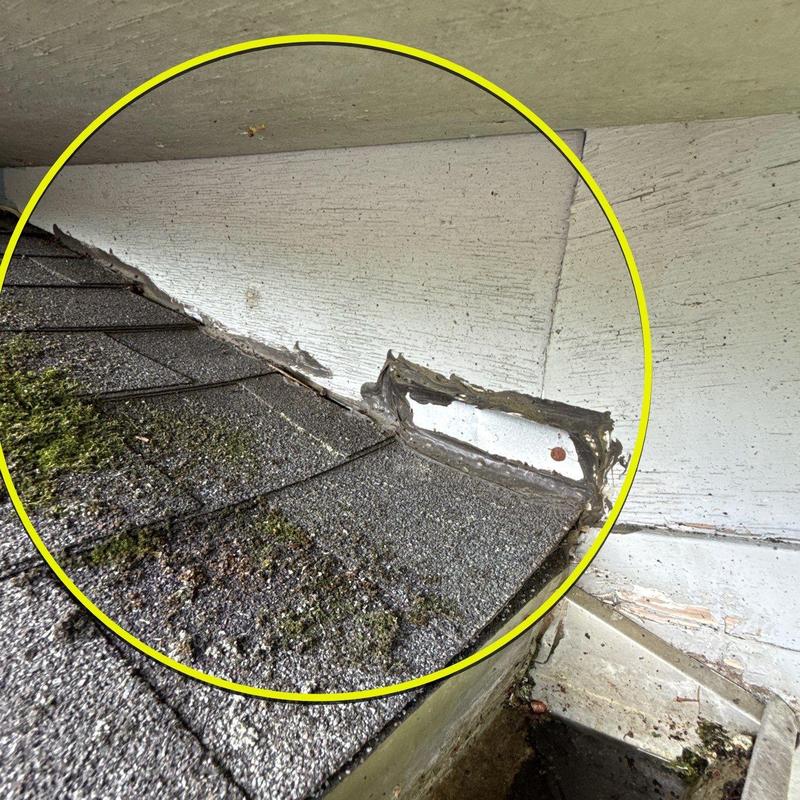 Roof flashing with deteriorated sealant and moss buildup