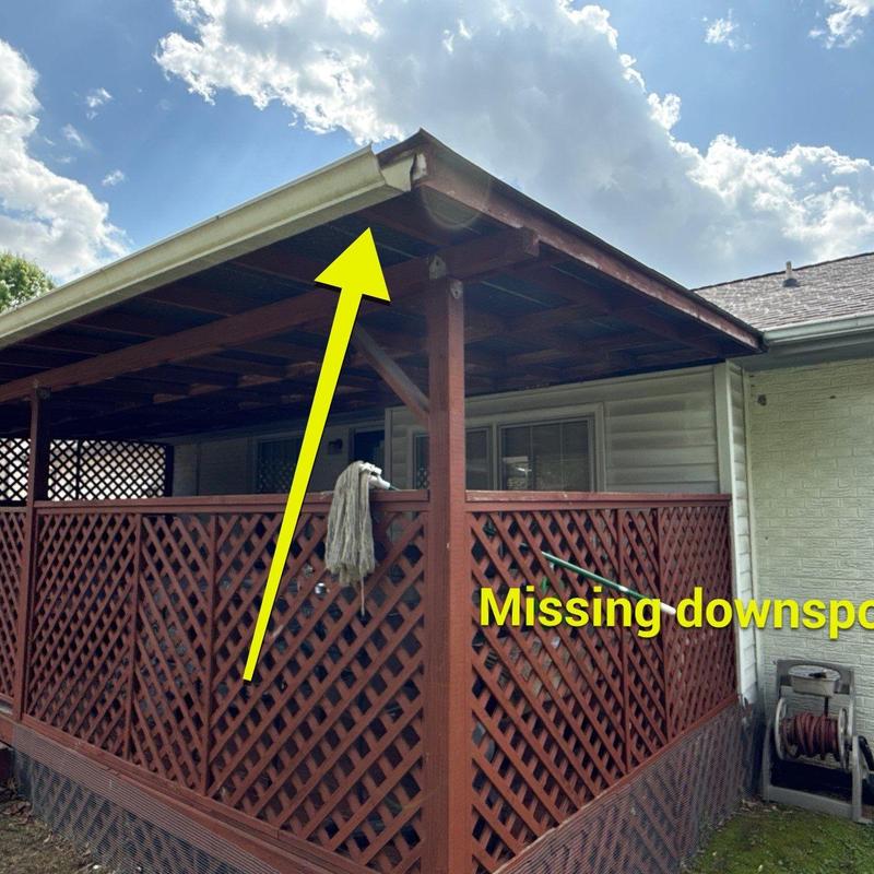 Gutter system missing downspout on porch roof