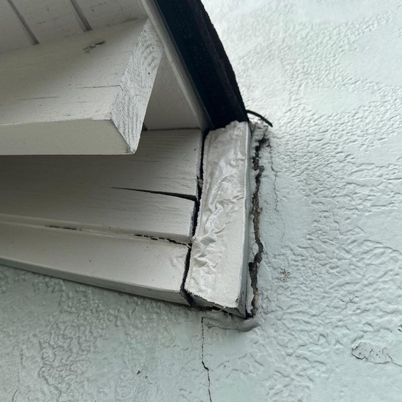 Wood fascia board with cracks and damage
