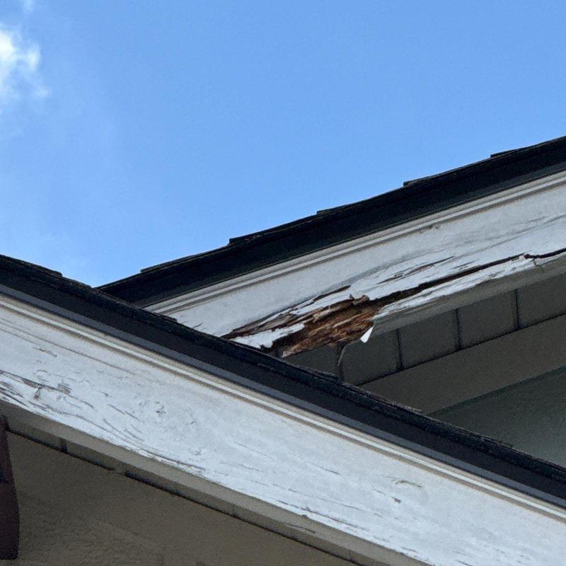 Wood fascia board with extensive rot and peeling paint