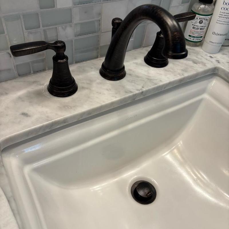 Delta widespread bathroom faucet installation on marble sink