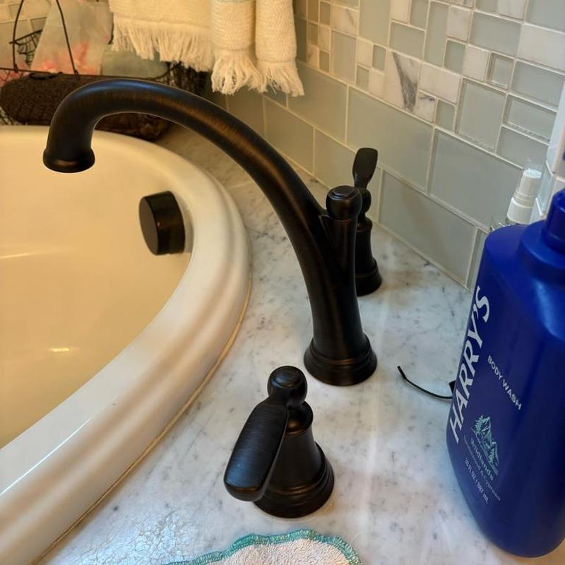 Delta widespread master bathroom faucets installed on marble