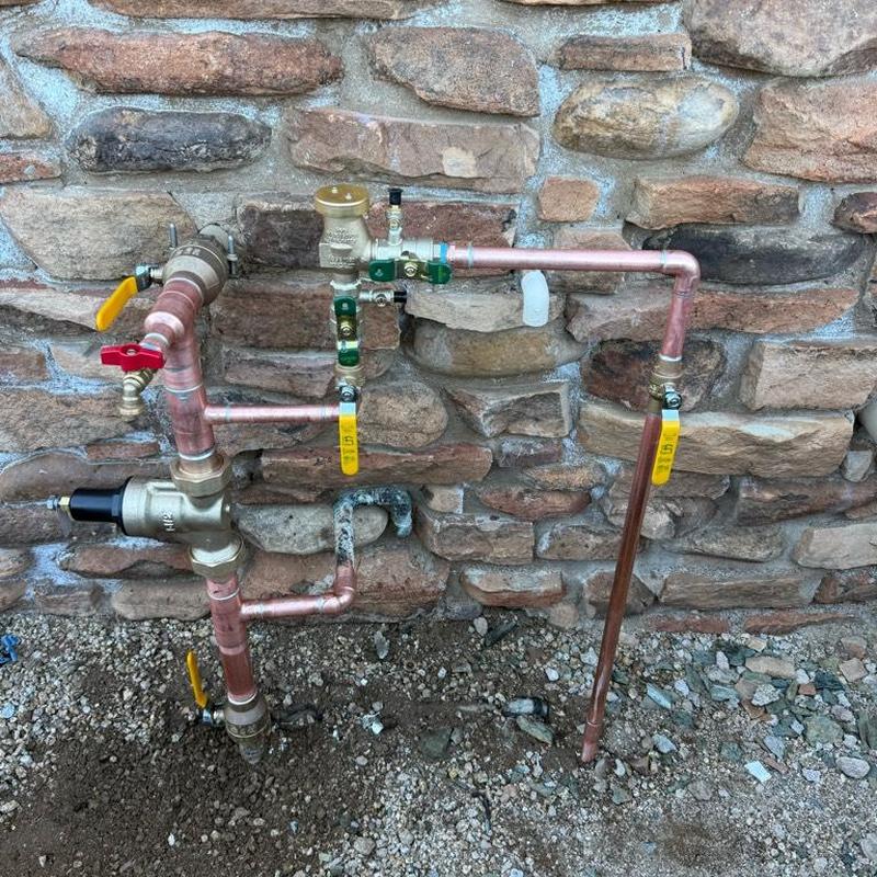 Main water service piping with valves and pressure vacuum breaker