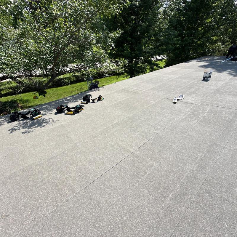 Mule-Hide SBS SA flat roofing with tools on roof Mule-Hide SBS SA flat roofing with tools on roof