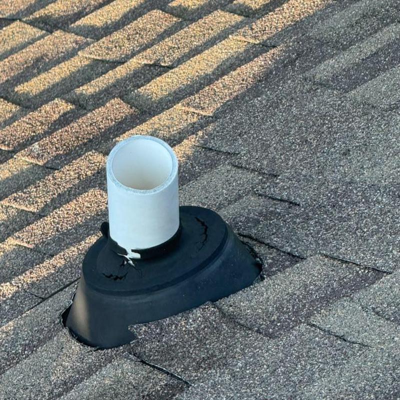 Cracked pipe boot on asphalt shingle roof