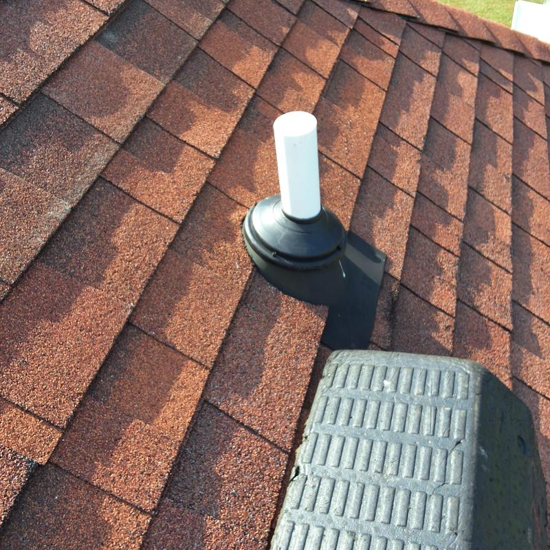 Roof vent pipe with new rubber collar and shingles Roof vent pipe with new rubber collar and shingles