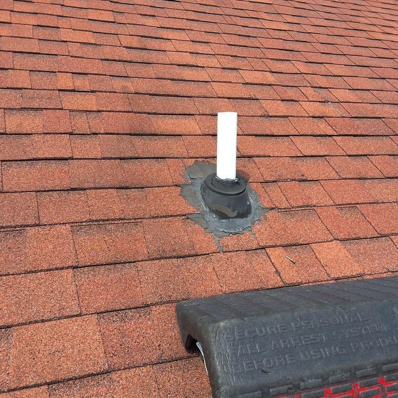 Roof vent pipe collar with new flashing and repaired shingles Roof vent pipe collar with new flashing and repaired shingles
