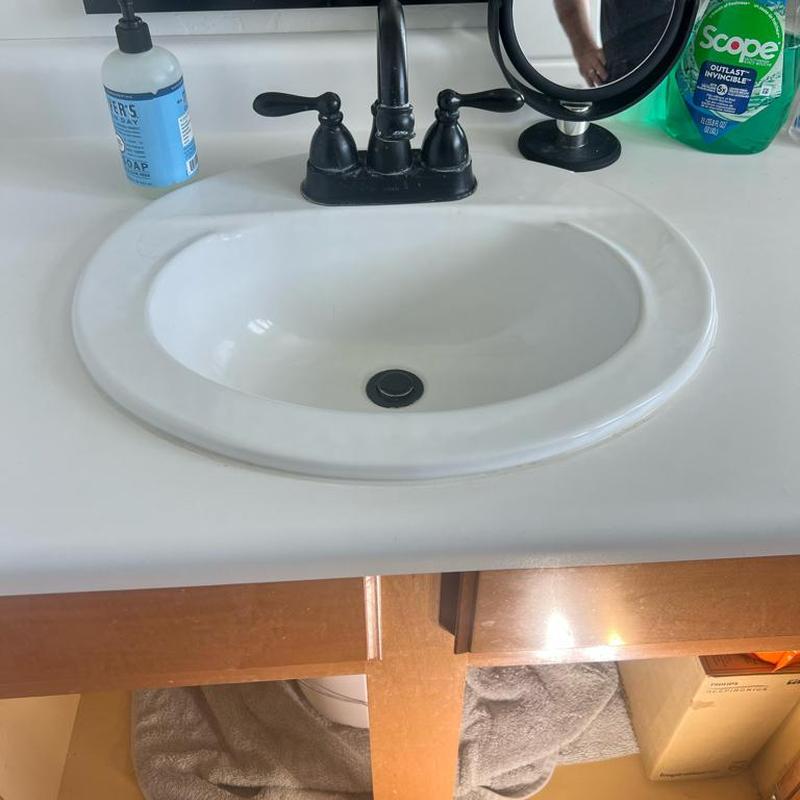 Bathroom sink tailpiece reassembled and sealed in Gilbert, AZ