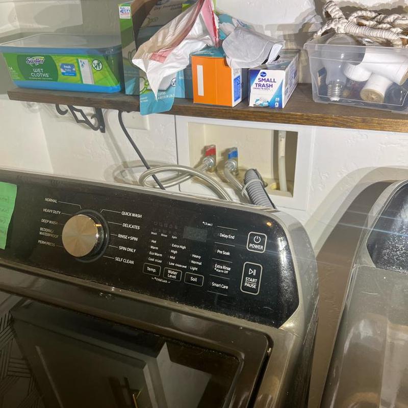 Washing machine cleaning cycle with vinegar in laundry room