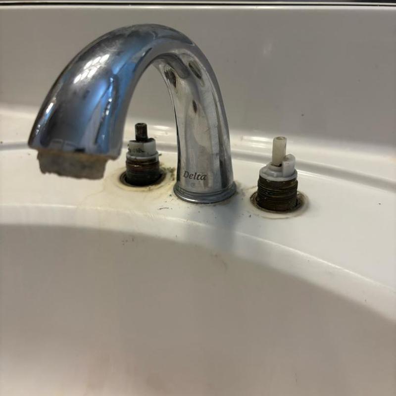Delta bathroom faucet valves removed for replacement in sink