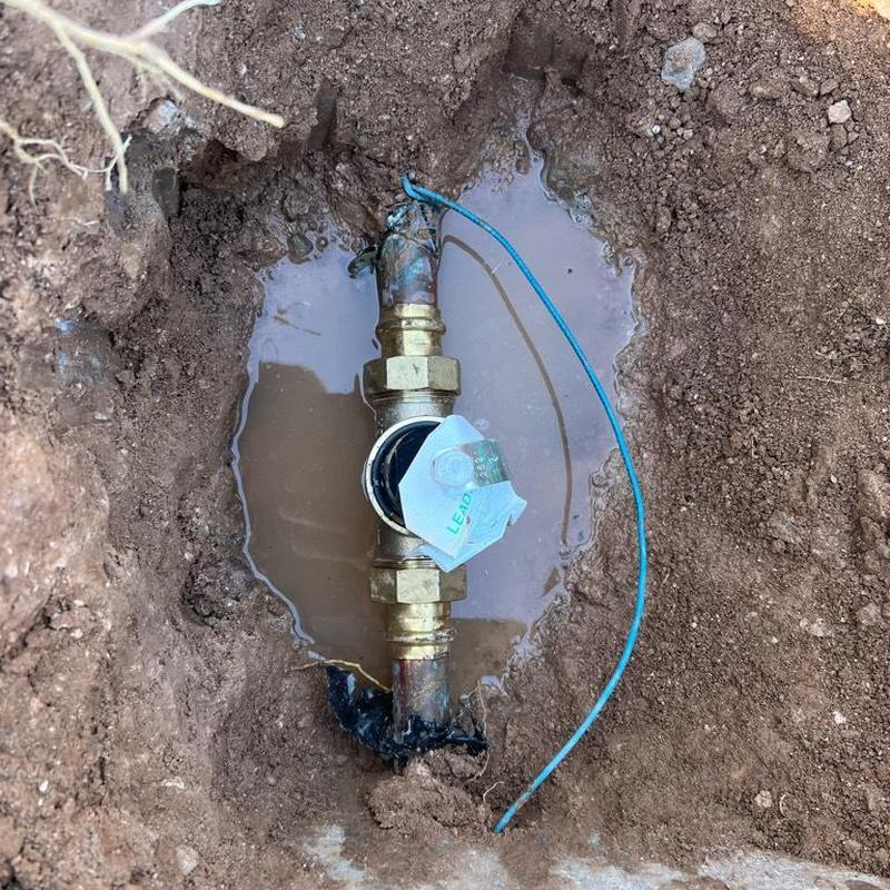 Pressure regulator valve installed in wet soil trench