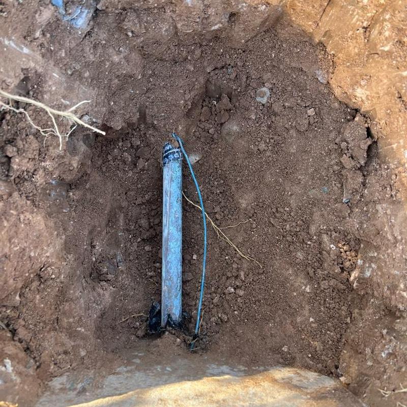 Pressure regulator valve installation in excavated soil hole