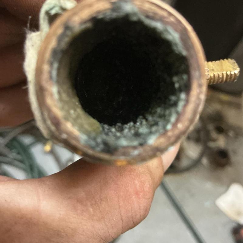 Corroded brass nipple from commercial water heater pipe Corroded brass nipple from commercial water heater pipe