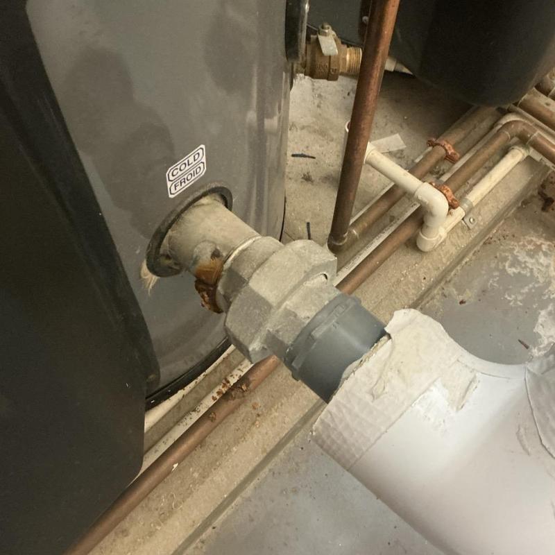 Commercial water heater with corroded brass nipple and pipe Commercial water heater with corroded brass nipple and pipe