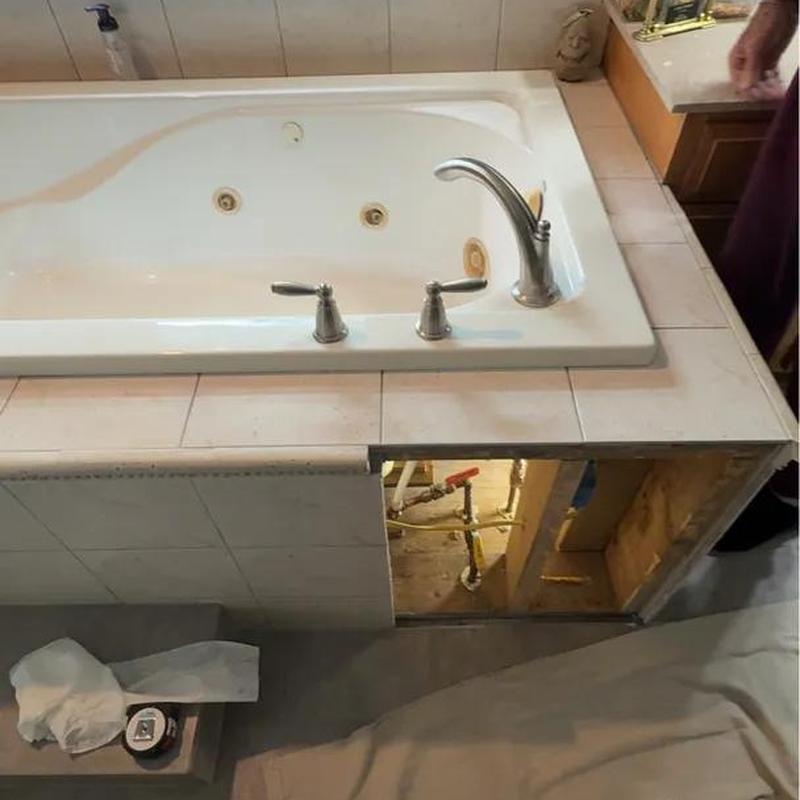 Roman tub faucet with access panel open