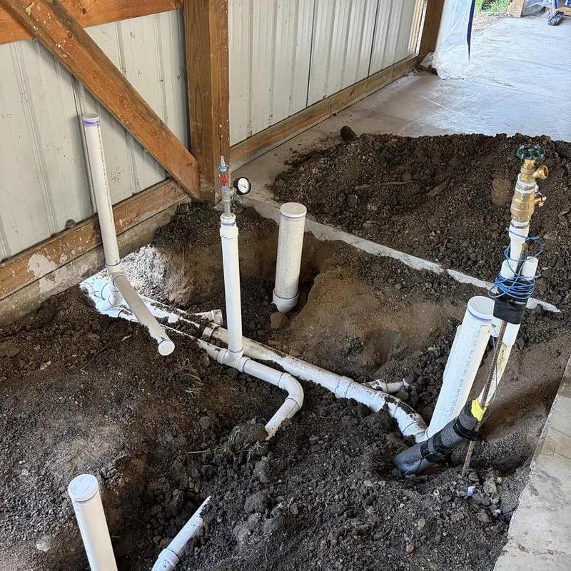 Underground PVC plumbing pipes installation in shop bathroom